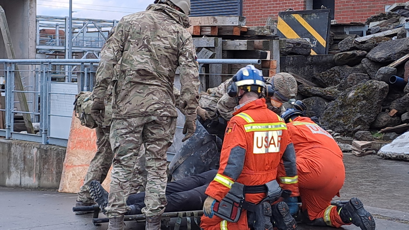 Volunteer acting as a casualty being rescued as part of a training exercise.