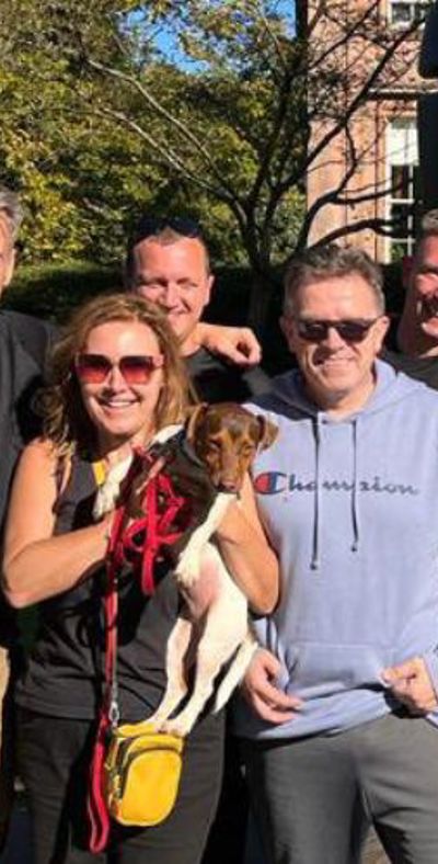 Firefighters with Still Game stars Jane McCarry and Mark Cox and their dog in front of an appliance