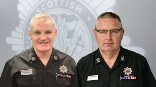 Andy Girrity and Ian McMeekin wearing a black uniform