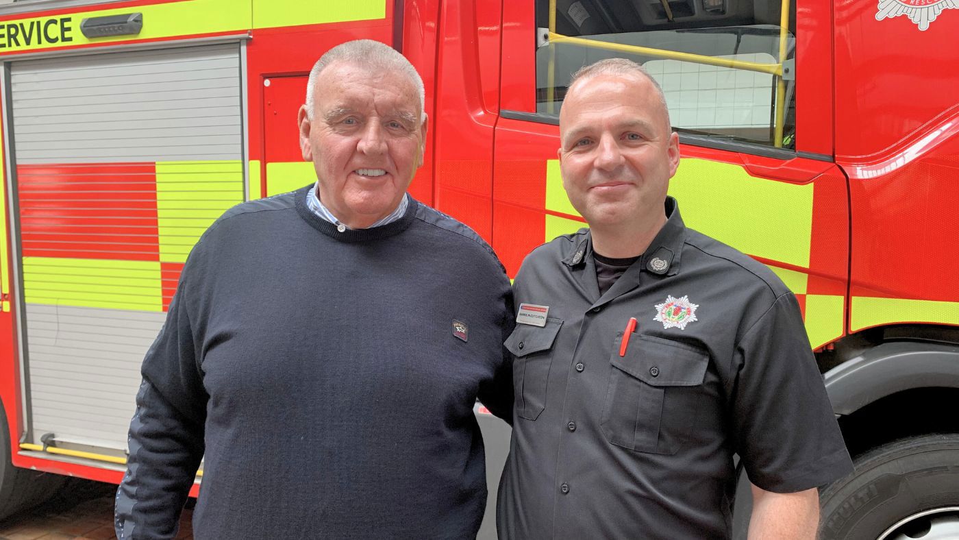 SFRS Group Commander Barrie Mccutcheon (right) with A.S. Scaffolding owner Andy Smillie (left) smiling at the camera following AS Scaffolding's donation to charities that support firefighters and their families.
