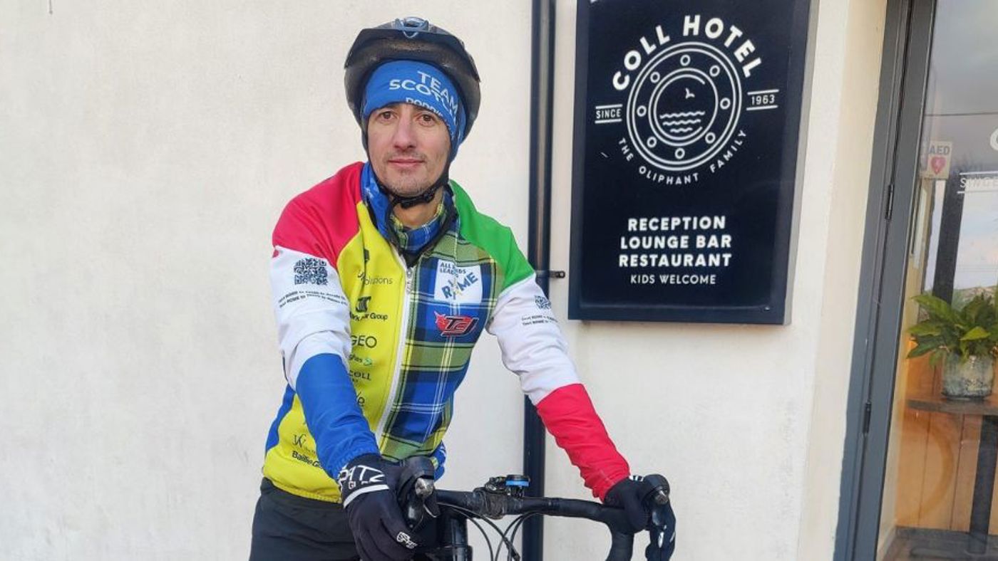 Cyclist outside hotel