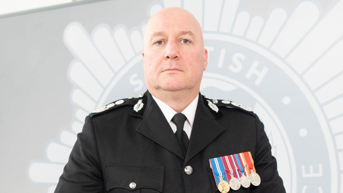 Chief Officer Ross Haggart standing in black uniform