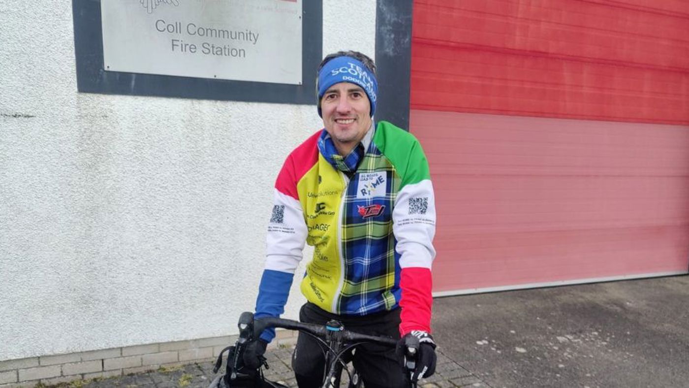 Cyclist outside fire station