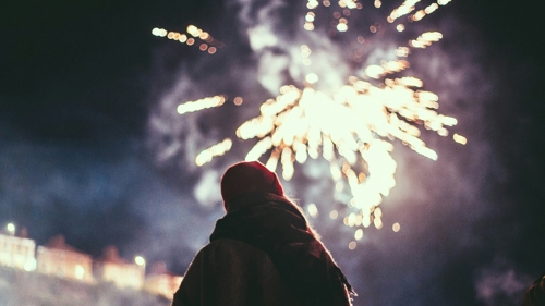 A person watching a firework display