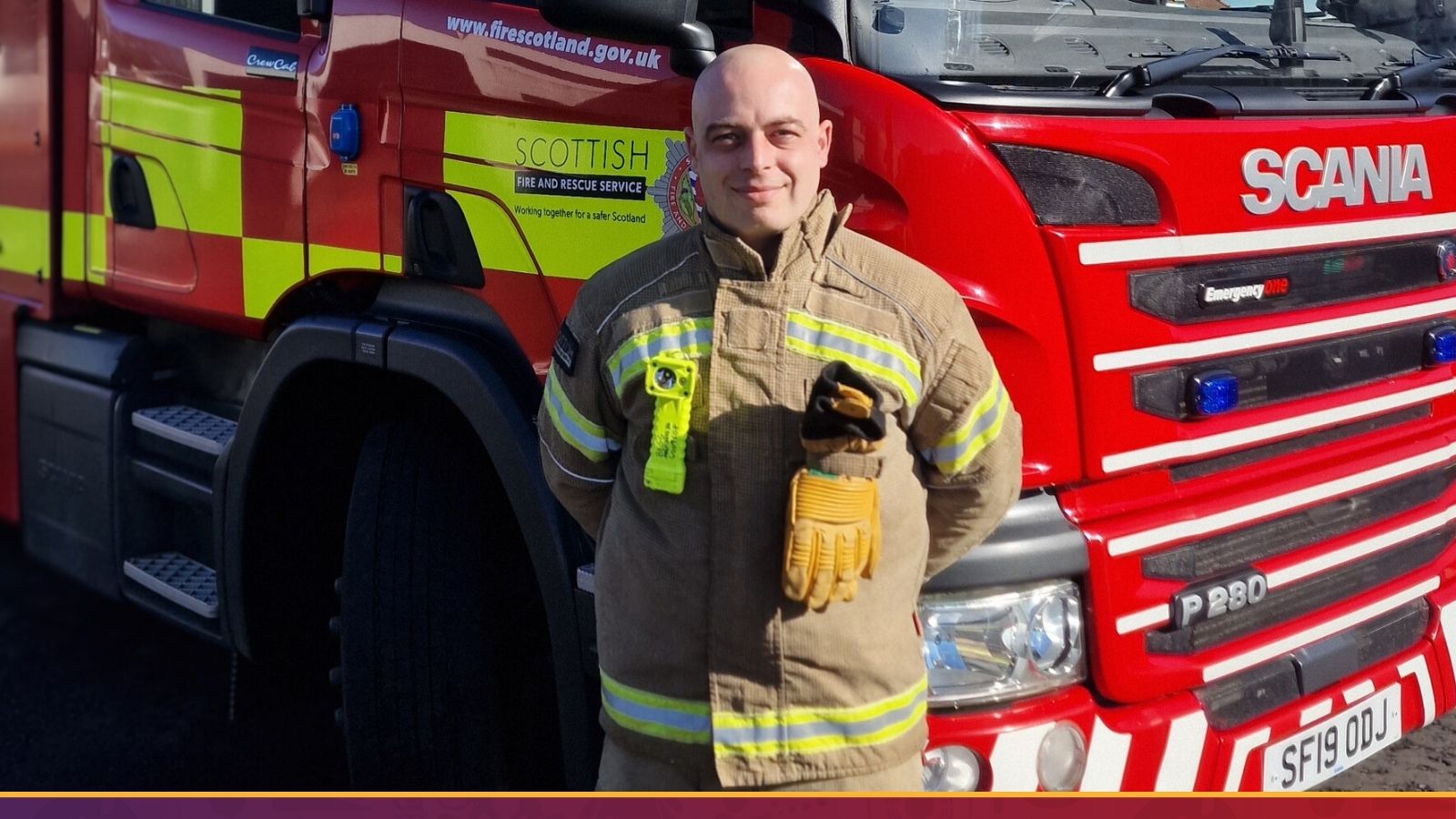 A firefighter in uniform poses next to a bright red fire truck, showcasing his readiness to respond to emergencies.