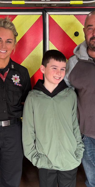 Riley with dad and firefighter