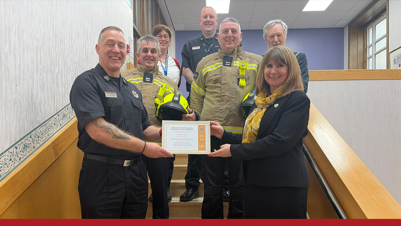 Group of people receiving an award