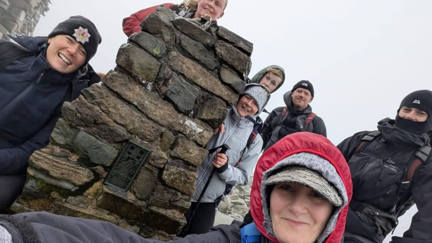 a group of people weather hiking clothes