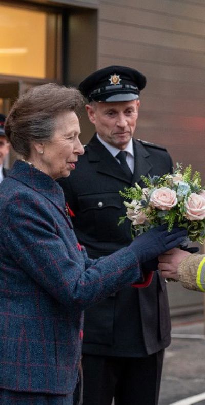 The Princess Royal was presented a posy by a firefighter