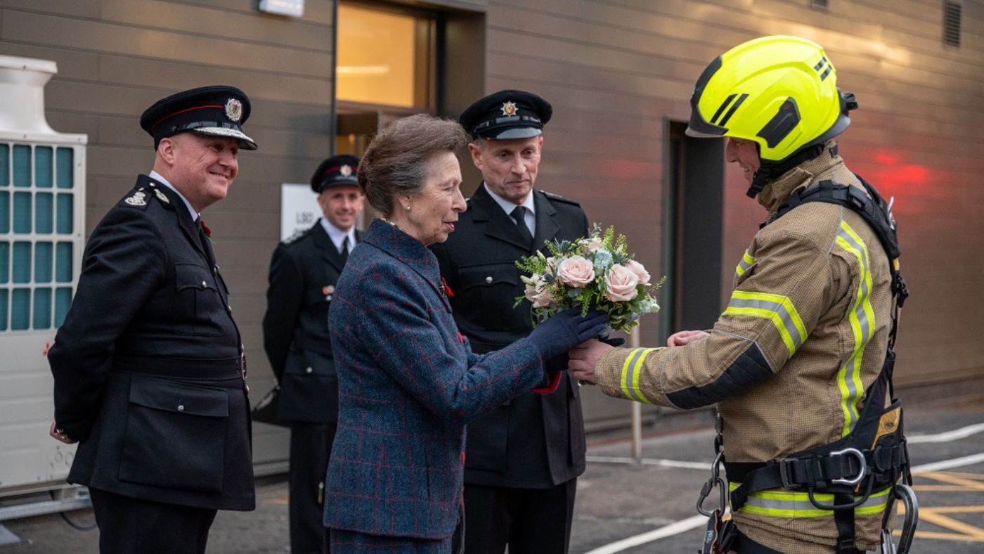 The Princess Royal was presented a posy by a firefighter