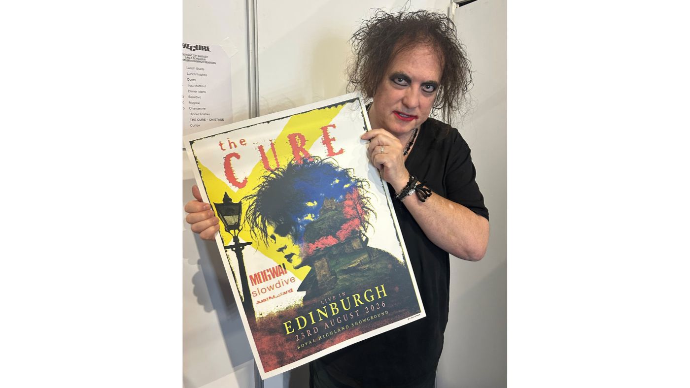 A man holding a poster